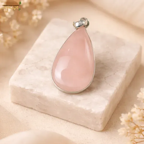 Genuine rose quartz drop shape pendant close-up — natural pink crystal heart chakra Suyagya
